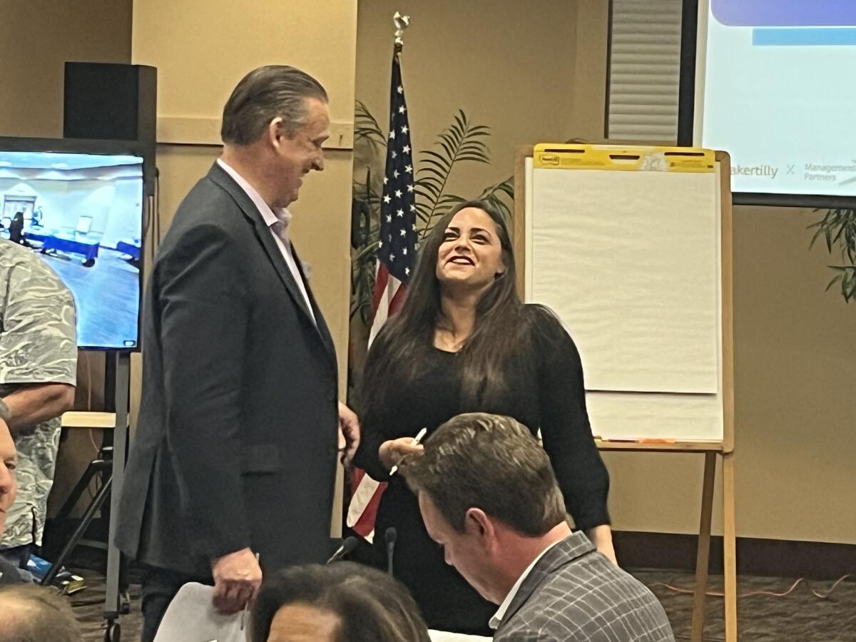 Huntington Beach Mayor Tony Strickland and Mayor Pro Tem Gracey Van Der Mark share a laugh at Thursday's workshop.