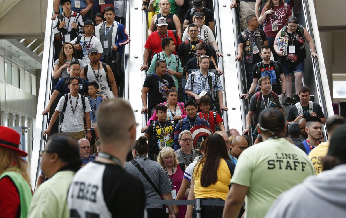 People on crowded escalators.