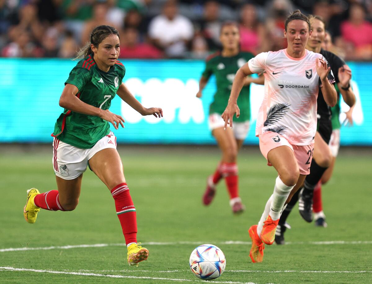 Mexico's Scarlett Camberos chases the ball during a match against Angel City FC.