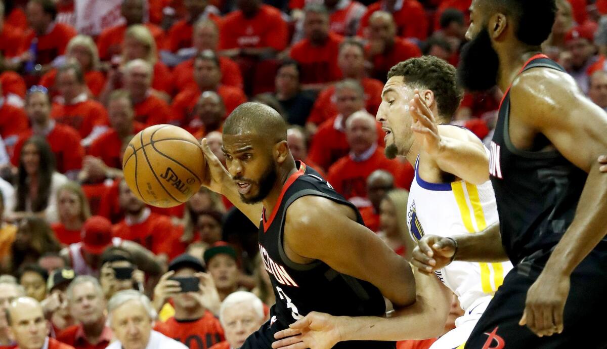 Rockets point guard Chris Paul drives against Warriors guard Klay Thompson during Game 2 of the Western Conference finals on May 16.