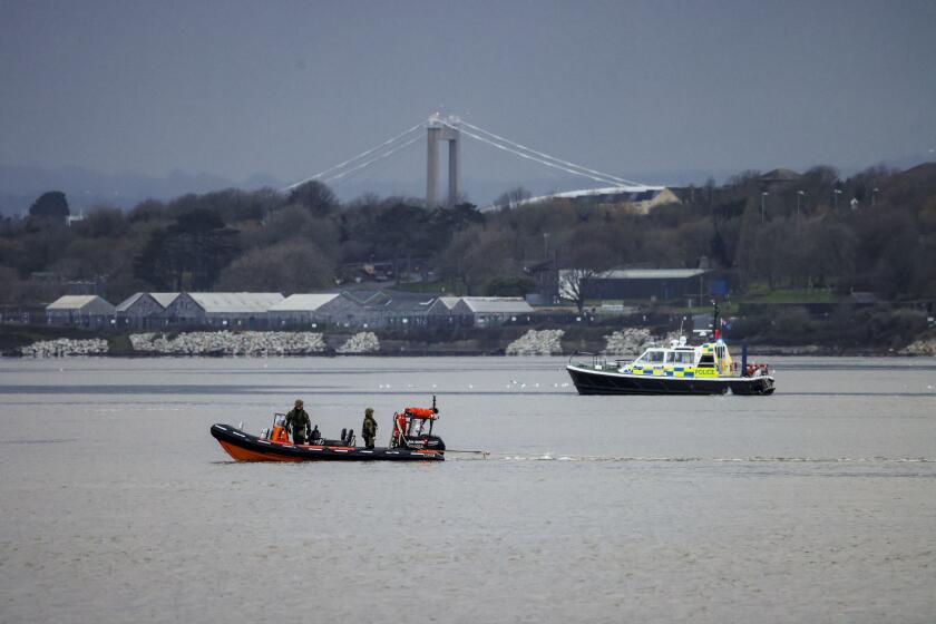 In this photo provided by the Ministry of Defence (MOD) on Friday, Feb. 23, 2024, the Royal Navy Bomb Disposal Team leave the slip to Torpoint Ferry as they dispose of the WWII bomb discovered in Keyham in Plymouth, England. Britain's Ministry of Defense says a World War II-era bomb whose discovery prompted one of the largest peacetime evacuations in British history has been detonated at sea. The 1,100-pound explosive was discovered Tuesday in the backyard of a home in Plymouth, a port city on the southwestern coast of Britain. (LPhot Barry Swainsbury/Ministry of Defence via AP)