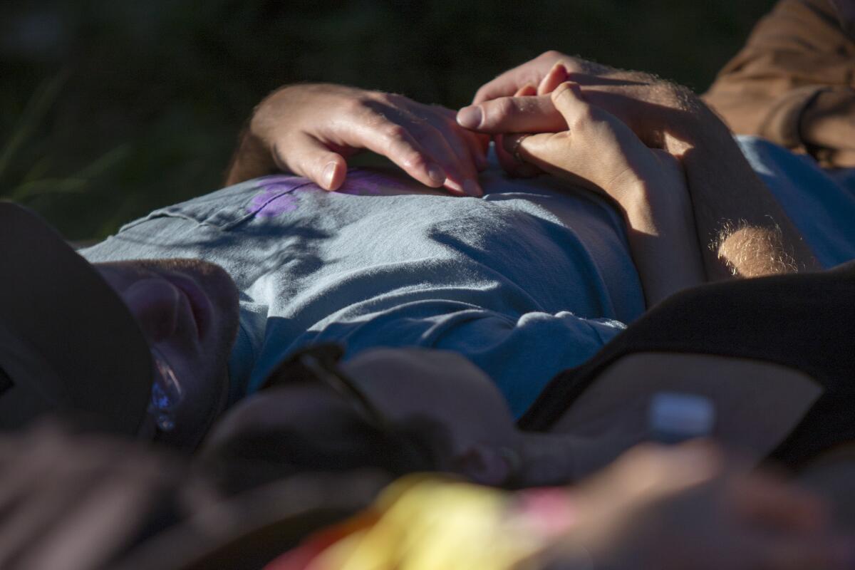 People lay down to relax during a musical gathering hosted by Floating