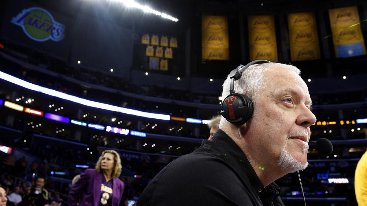 Lakers arena announcer Lawrence Tanter looks on before the start of a game against the Minnesota Timberwolves in 2011.