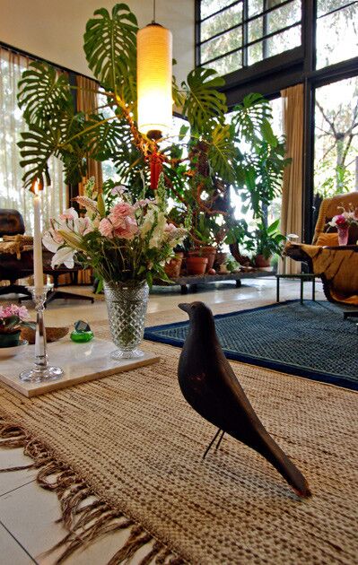 The living room does not resemble the type of rigorously formal space that people today expect in a modern house from the era. Even though the Eames House is a wonderfully calibrated exercise in steel, glass and concrete panel, inside, the architecture takes a back seat to the extraordinarily diverse collection of objects. Here, an American folk art crow decoy.