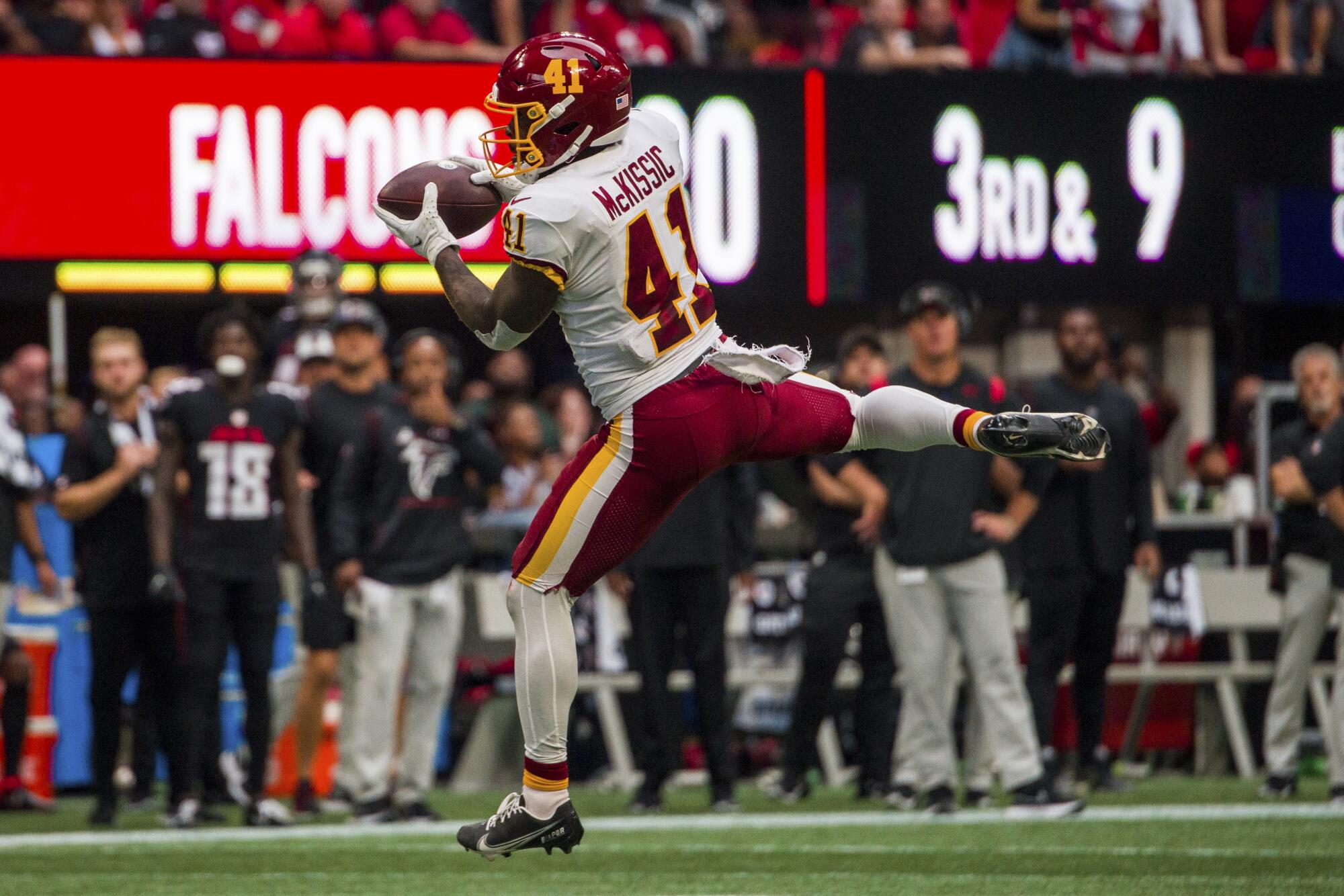 Washington Football Team running back J.D. McKissic catches a pass.