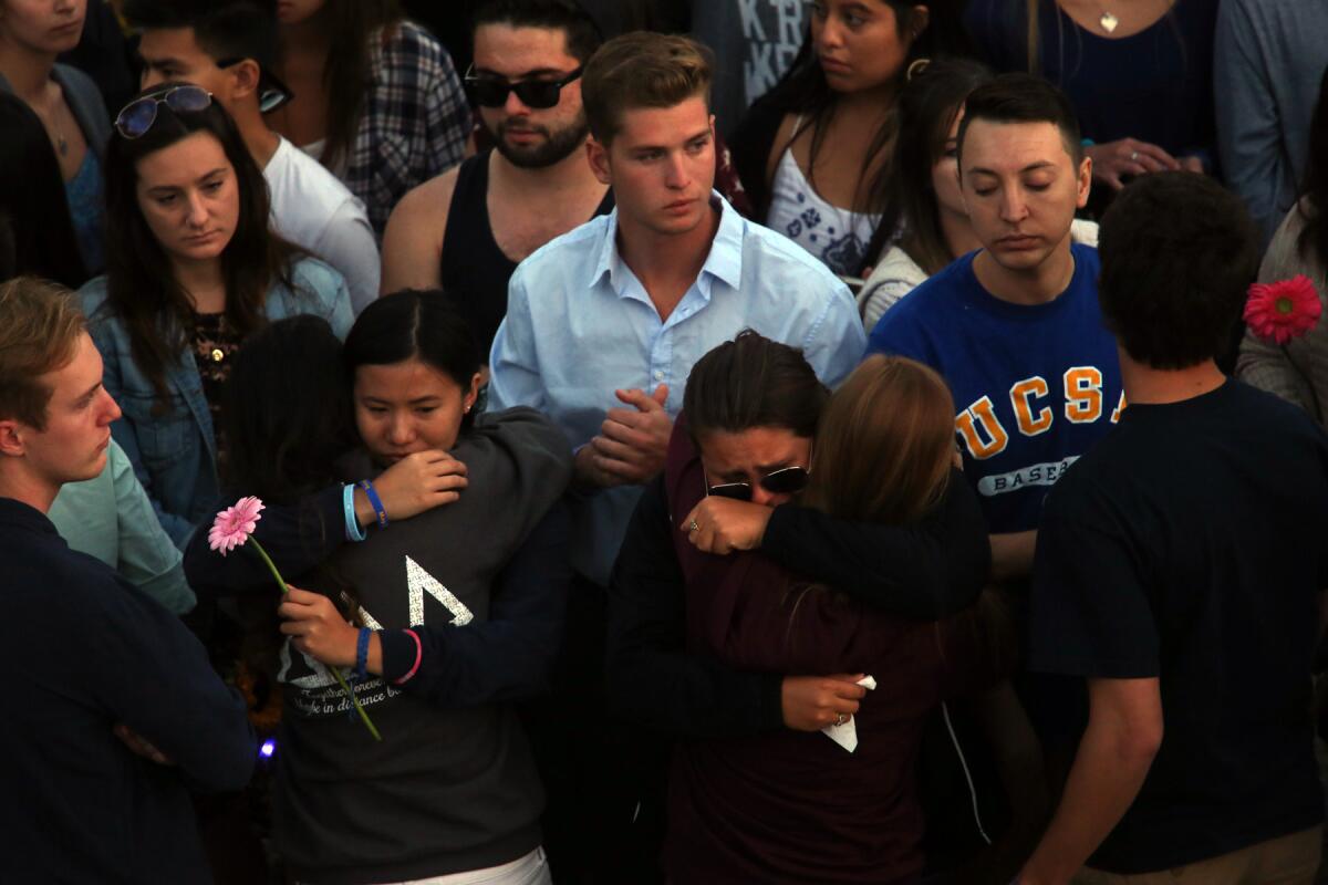Santa Barbara residents and UC Santa Barbara students come together for a student-led gathering in remembrance of those who were killed and injured in Elliot Rodger's rampage one year ago.