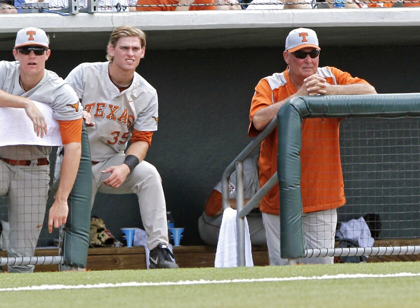 Texas Coach Augie Garrido, right, looks on against Houston in the fourth inning of an NCAA college baseball tournament super regional game on Friday.