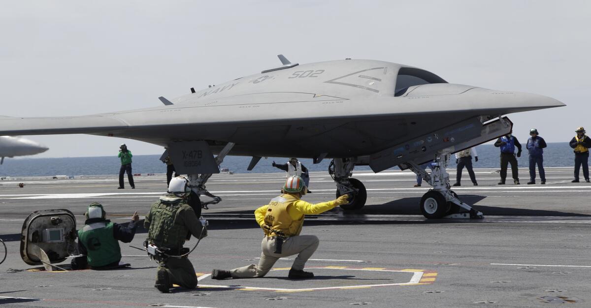 A Navy X-47B drone is launched off the aircraft carrier George H.W. Bush off the coast of Virginia in May.