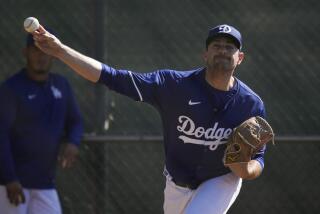 Los Angeles Dodgers relief pitcher Daniel Hudson participates in spring training baseball workouts at Camelback Ranch in Phoenix, Sunday, Feb. 18, 2024. (AP Photo/Ashley Landis)