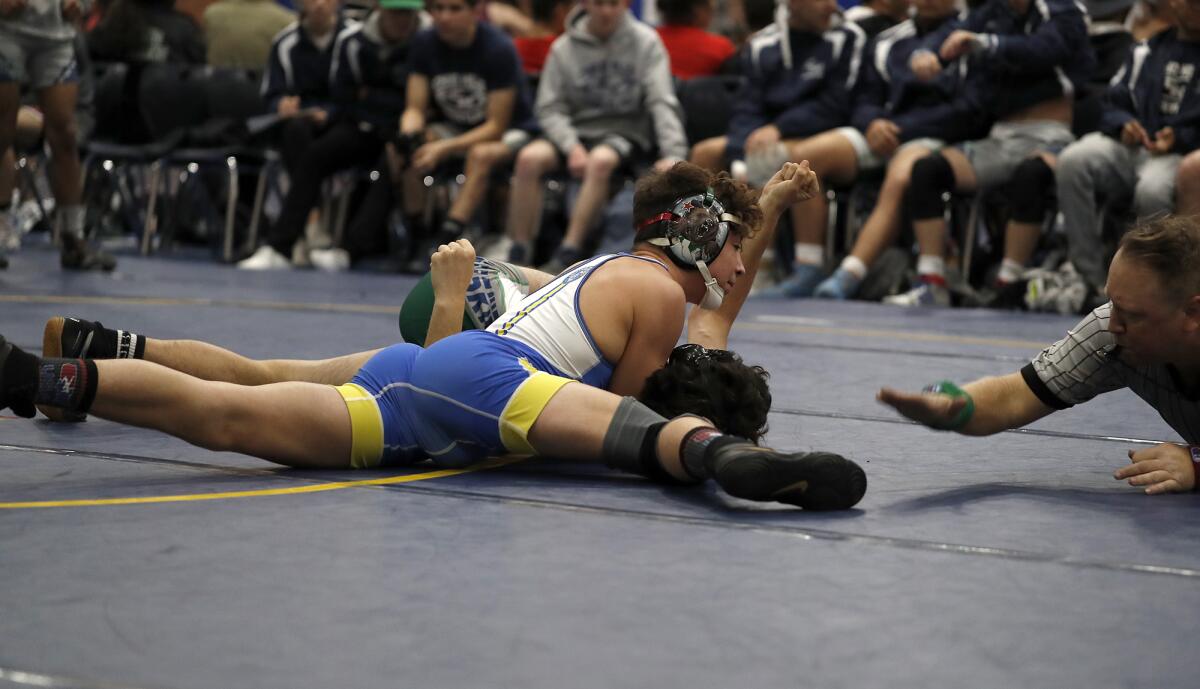 Fountain Valley's Zach Parker competes against Chino Hills in a 126-pound match during the first round of the CIF Southern Section Division 3 dual meet wrestling championships at Fountain Valley High on Saturday.