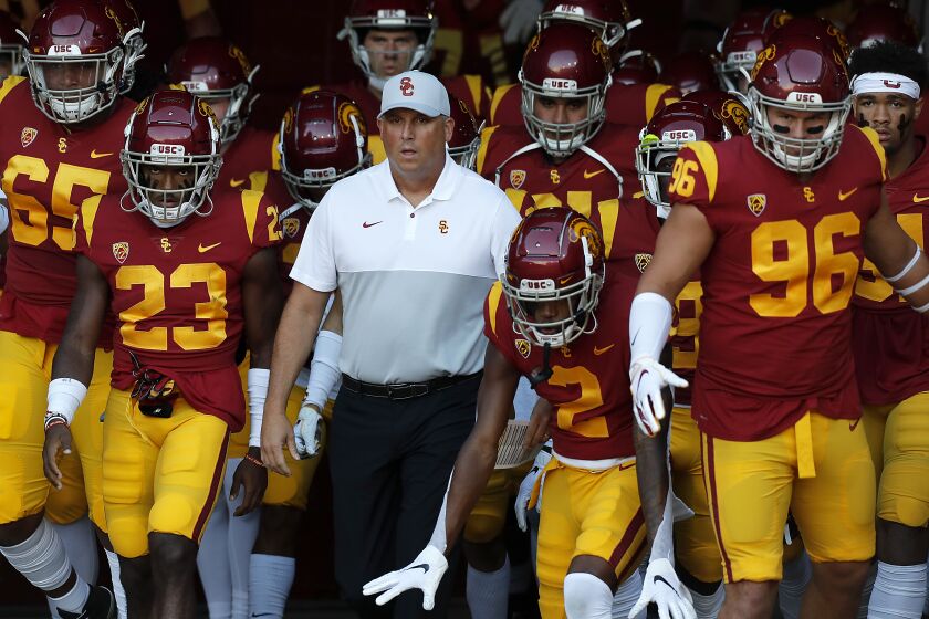 LOS ANGELES, CALIF. - SEP. 20, 2019. USC head coach Clay Helton leads his team out of the tunnel for the game against Utah at the L.A. Memorial Coliseum on Friday night, Sep. 20, 2019. (Luis Sinco/Los Angeles Times)