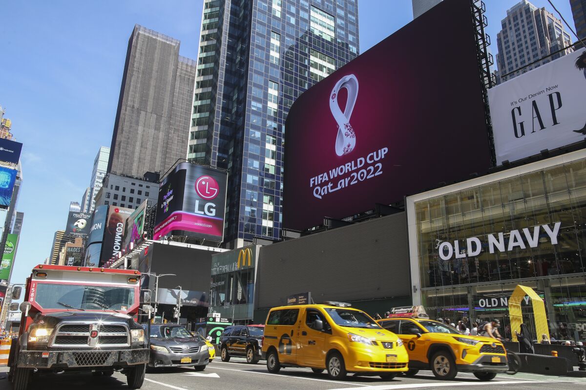 An electronic billboard displays a FIFA World Cup Qatar 2022 soccer logo in New York's Times Square.