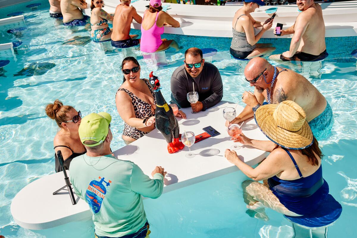 Guests at a swim-up bar aboard Royal Caribbean's Icon of the Seas.