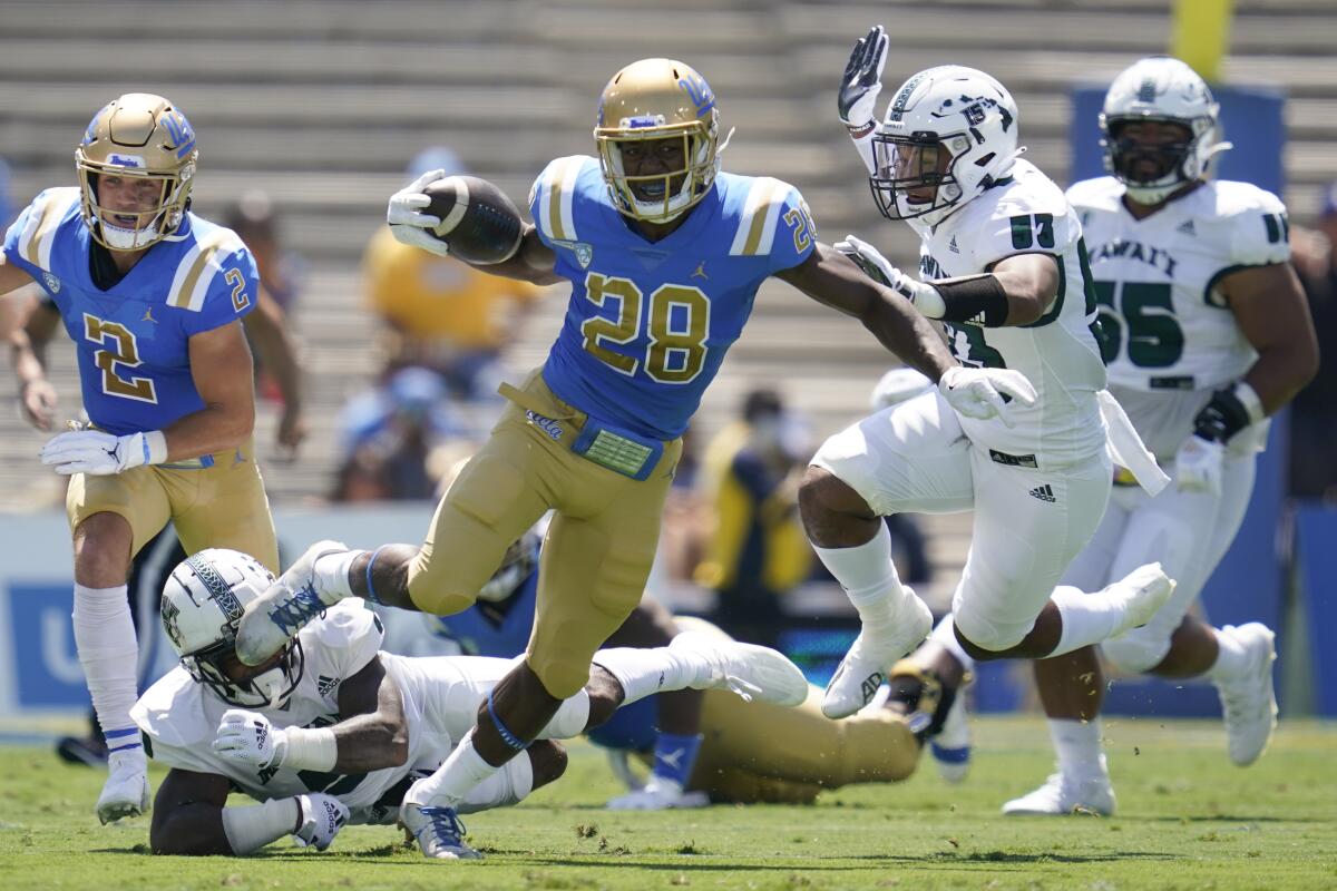 UCLA's Brittain Brown runs with the ball during the first half Aug. 28, 2021, in Pasadena, Calif. 