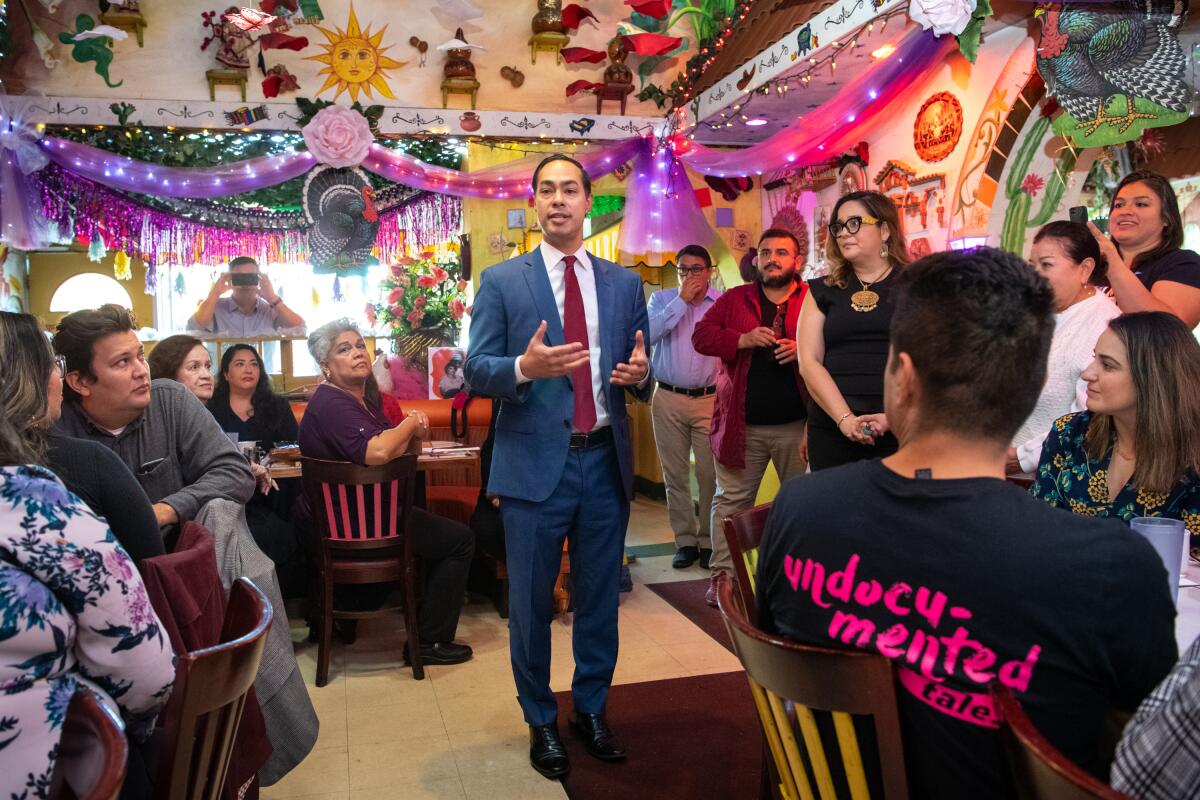 Presidential candidate Julián Castro talks with patrons on a recent visit to La Parrilla restaurant in Boyle Heights.