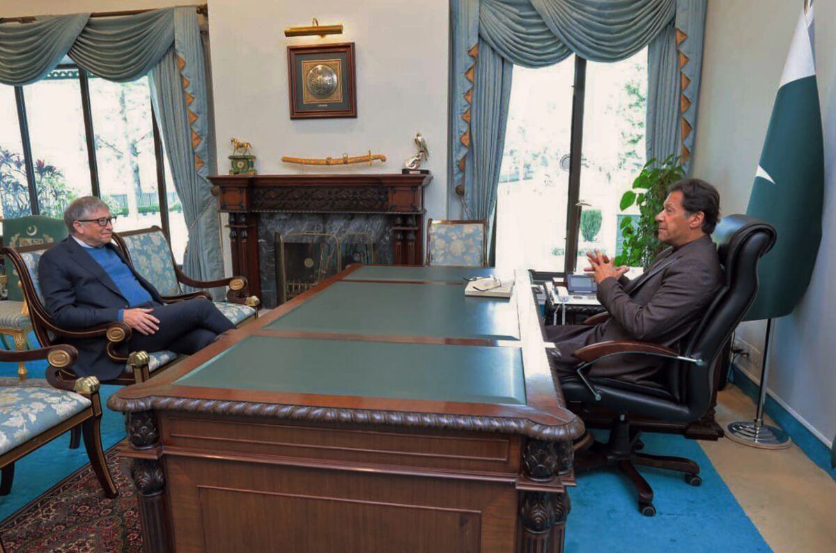 In this photo released by Pakistan's Press Information Department, Microsoft co-founder and billionaire philanthropist Bill Gates, left, listens to Pakistan's Prime Minister Imran Khan during their meeting in Islamabad, Pakistan, Thursday, Feb. 17, 2022. Gates praised Pakistan on Thursday for its response to COVID-19 despite its limited resources, as fatalities from coronavirus continued a steady decline in the country. (Press Information Department via AP)