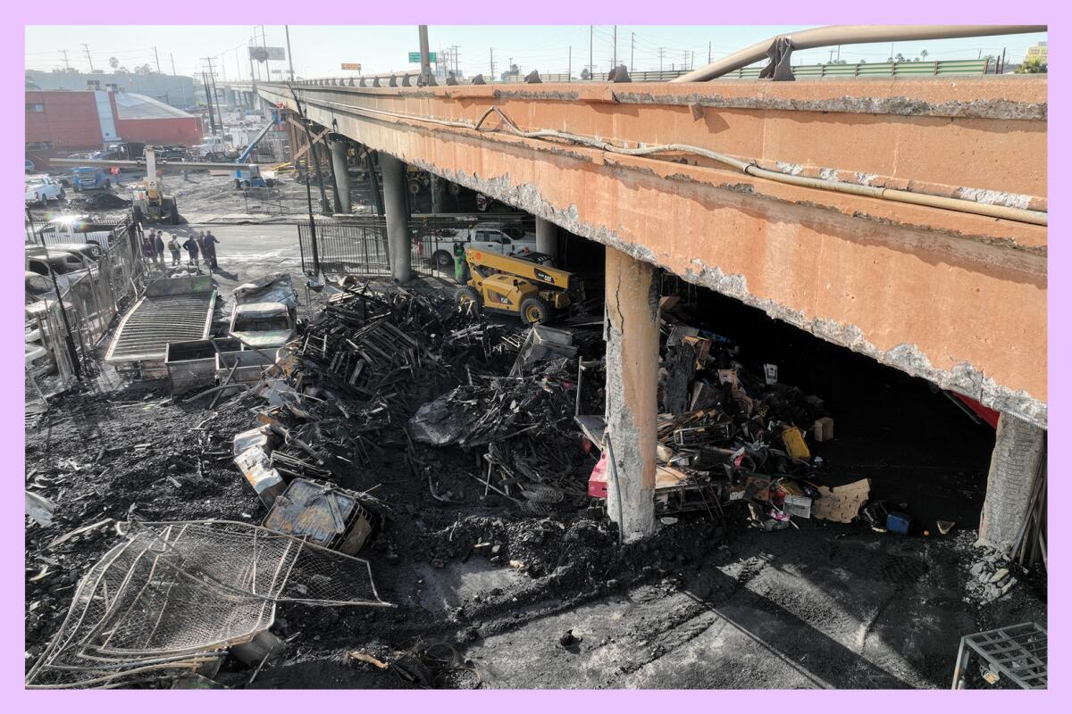Aerial view of the 10 Freeway showing a fire-damaged bridge surrounded by burned items including cars and twisted metal