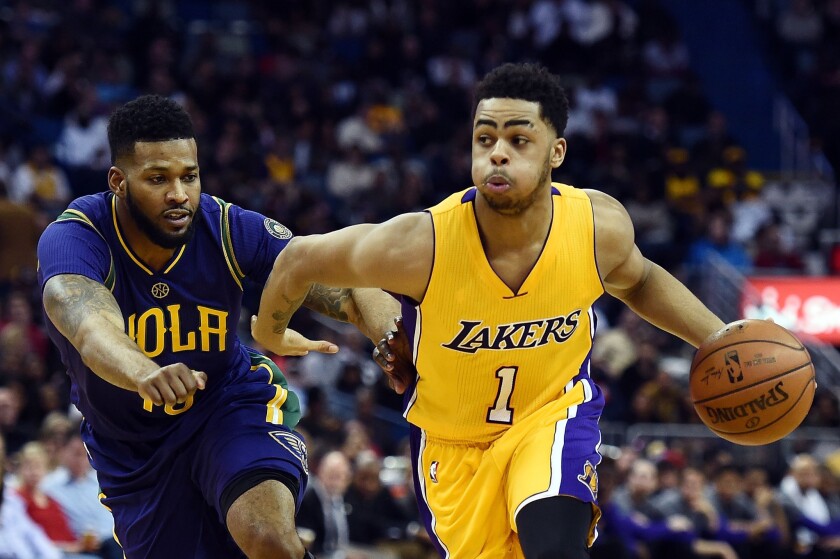 Lakers guard D'Angelo Russell drives to the basket against Pelicans guard Alonzo Gee during the second half.