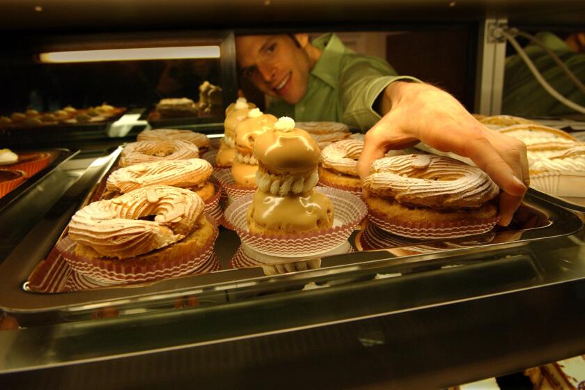 It's a large ring of choux paste sliced horizontally, filled with praline pastry cream and whipped cream and topped with toasted almonds. Recipe: Paris-Brest