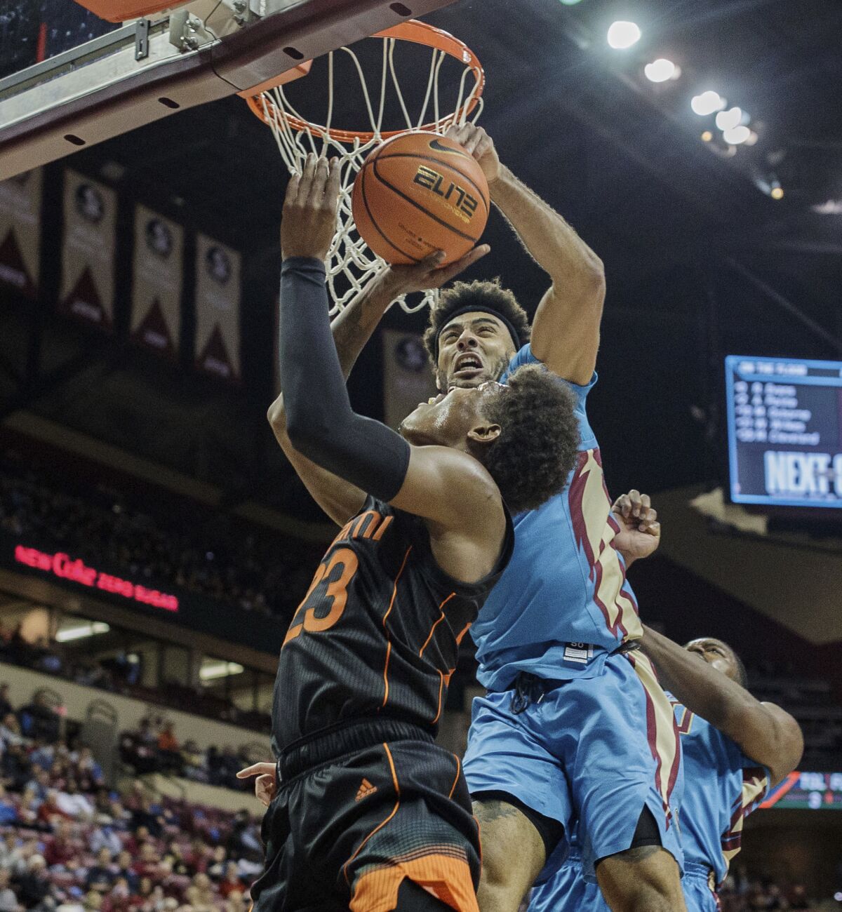Miami guard Kameron McGusty (23) is blocked by Florida State guard Anthony Polite (2) during an NCAA college basketball game at the Tucker Civic Center on Tuesday, Jan. 11, 2022, Tallahassee, Fla. (Alicia Devine/Tallahassee Democrat via AP)