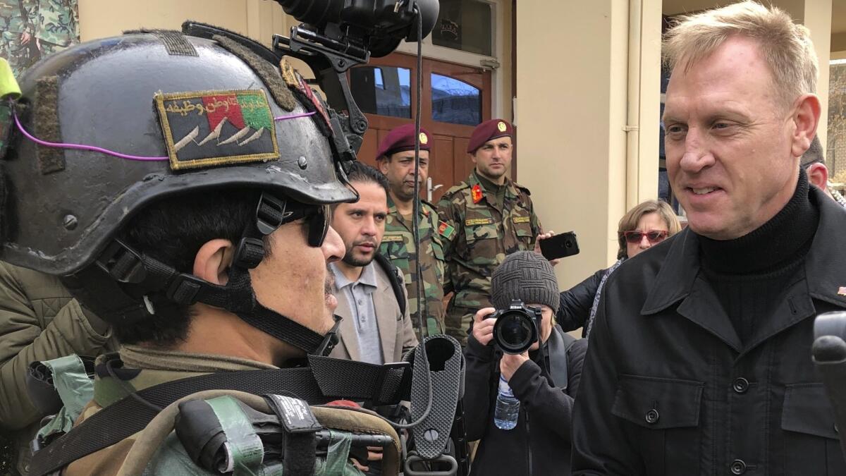 Acting Defense Secretary Pat Shanahan greets an Afghan commando on Feb. 11.