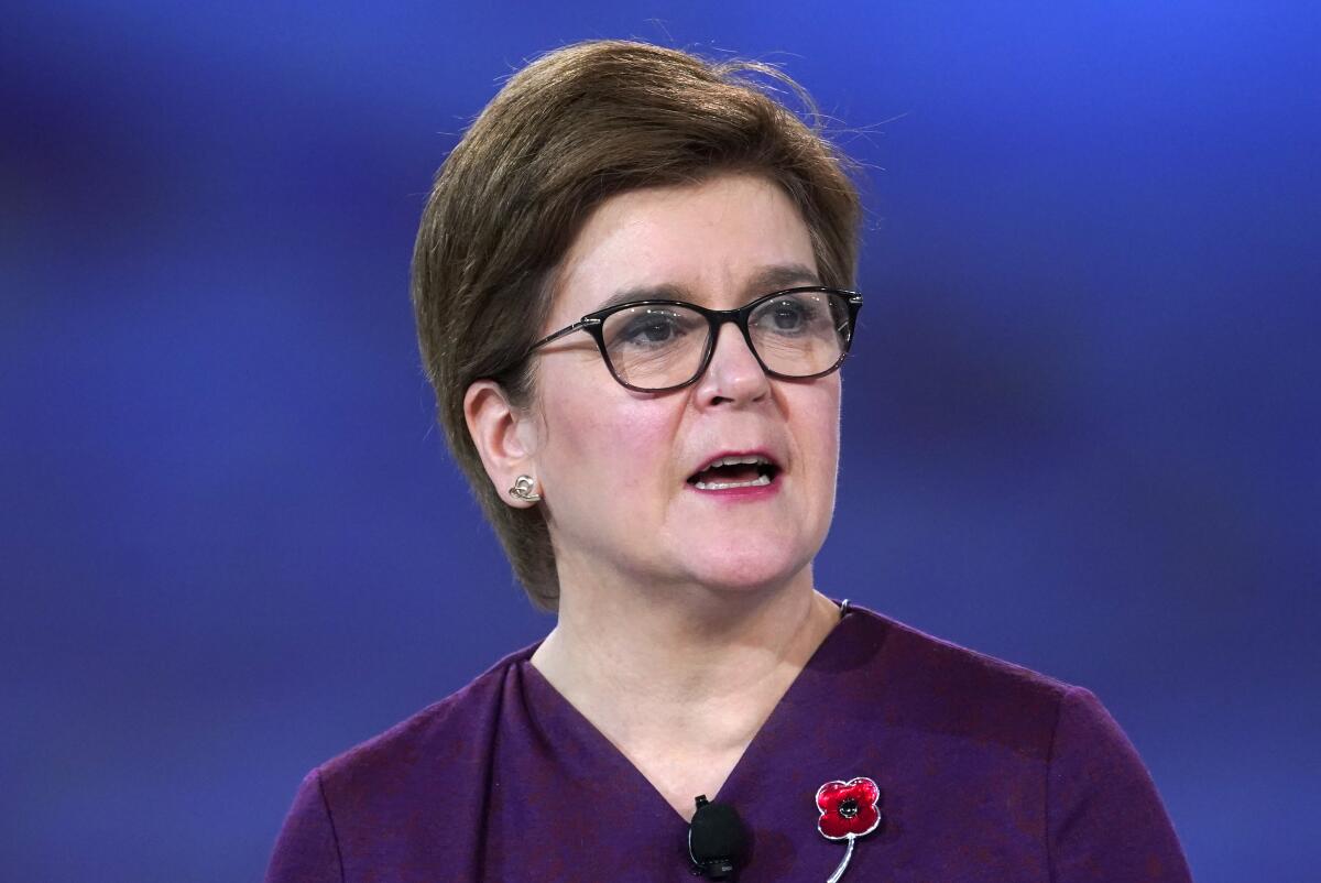 FILE - Scotland's first minister Nicola Sturgeon speaks at a session inside the venue of the COP26 U.N. Climate Summit in Glasgow, Scotland, on Nov. 9, 2021. Scotland’s leader says she will renew her push for independence from the United Kingdom next year, with the aim of holding a referendum on secession in 2023. First Minister Nicola Sturgeon said Monday that the independence campaign “will resume in earnest” in spring 2022, “COVID permitting.” (AP Photo/Alberto Pezzali)