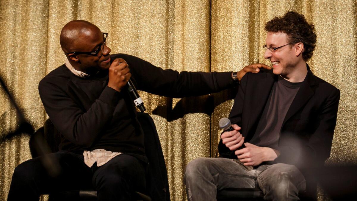Nicholas Britell, right, is shown with "Moonlight" director Barry Jenkins after a screening of the film with live orchestra accompaniment last month in downtown Los Angeles.