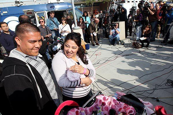 Yovani Guido, 24, left, his fiancee Haydee Ibarra, 22, and their daughter Melinda Star Guido attend a news conference as Los Angeles County-USC Medical Center as Melinda is discharged from the hospital. She was born on Aug. 30, 2011, and weighed 9.5 ounces.