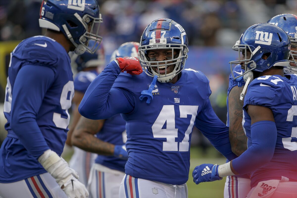 FILE - New York Giants outside linebacker Alec Ogletree (47) reacts during the third quarter of an NFL football game against the Miami Dolphins, Sunday, Dec. 15, 2019, in East Rutherford, N.J. The New York Jets have signed former Rams and Giants linebacker Alec Ogletree to their practice squad. The team also announced Thursday,Sept.10, 2020, it signed former Ravens wide receiver Jaleel Scott to the practice squad and placed wide receiver Donte Moncrief on the practice squad injured reserve list.(AP Photo/Seth Wenig, FIle)