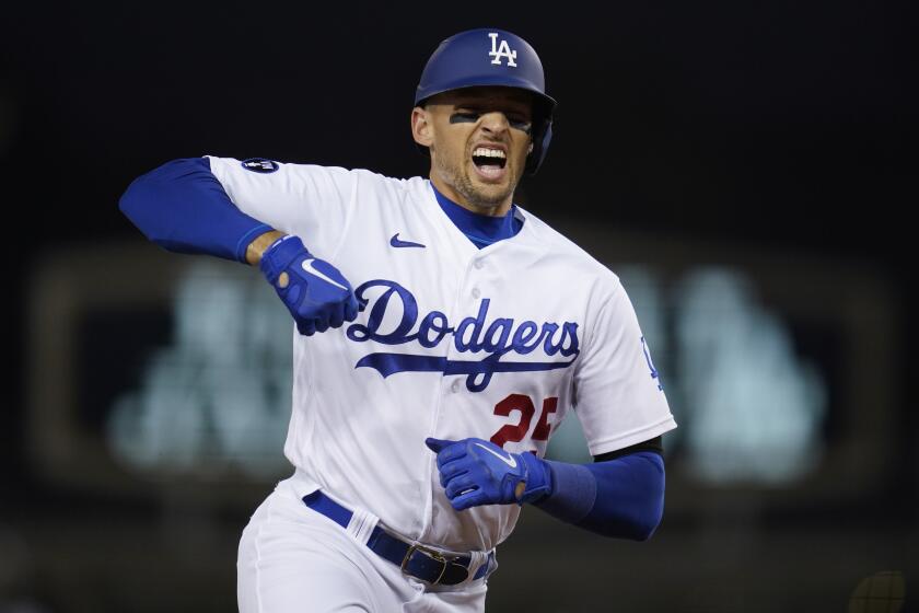 Los Angeles Dodgers designated hitter Trayce Thompson (25) reacts after hitting a home run during the second inning of a baseball game against the Milwaukee Brewers in Los Angeles, Tuesday, Aug. 23, 2022. Joey Gallo and Cody Bellinger also scored. (AP Photo/Ashley Landis)
