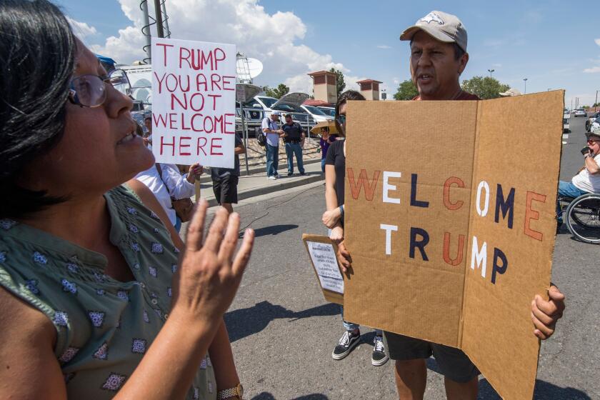 Anti-Trump protesters argue with Trump supporters outside the makeshift memorial to the victims of the WalMart shooting that left a total of 22 people dead, in El Paso, Texas, on August 7, 2019. - President Donald Trump consoled victims of a mass shooting in Ohio on Wednesday but protesters and opponents denounced what they say is his extremist rhetoric on race and immigration. The president's trip to Dayton, where nine people were gunned down over the weekend, was to be followed immediately after by a stop in the border city of El Paso, Texas, where 22 were murdered. (Photo by Mark RALSTON / AFP) (Photo credit should read MARK RALSTON/AFP/Getty Images)