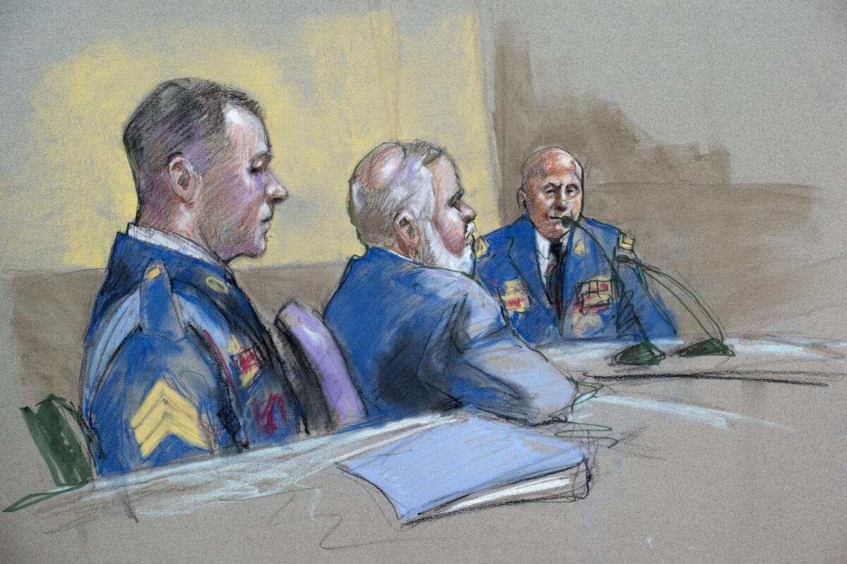Army Sgt. Bowe Bergdahl, left, and defense lead counsel Eugene Fidell, center, look on as Maj. Gen. Kenneth Dahl is questioned at a preliminary hearing.
