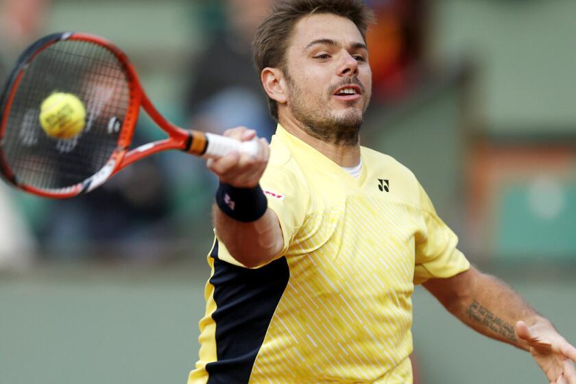 Stan Wawrinka reaches for a forehand return against Guillermo Garcia-Lopez in a first-round match at the French Open on Monday.