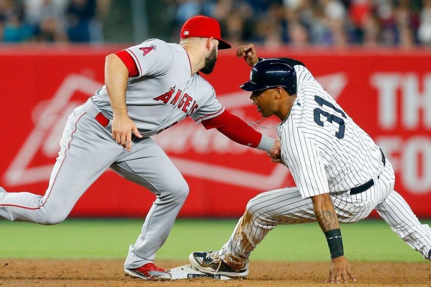 NEW YORK, NY - JUNE 21: Aaron Hicks #31 of the New York Yankees is tagged out trying to steal second base in the fifth inning by Danny Espinosa #3 of the Los Angeles Angels of Anaheim at Yankee Stadium on June 21, 2017 in the Bronx borough of New York City. (Photo by Jim McIsaac/Getty Images) ** OUTS - ELSENT, FPG, CM - OUTS * NM, PH, VA if sourced by CT, LA or MoD **