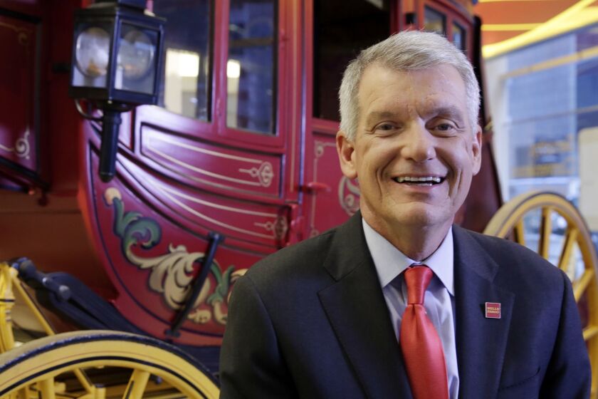 Wells Fargo CEO & President Timothy Sloan poses for photos in one of his bank's branches, in New York, Friday, March 17, 2017. Sloan says that it's too early to gauge President Trump's job performance, but says that he will succeed as long as the White House focuses on jobs and economic growth. (AP Photo/Richard Drew)