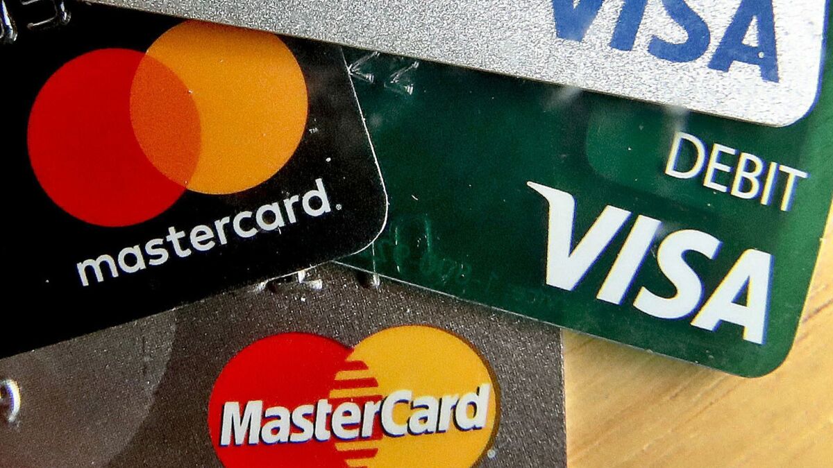 The average credit score is rising, according to Experian.