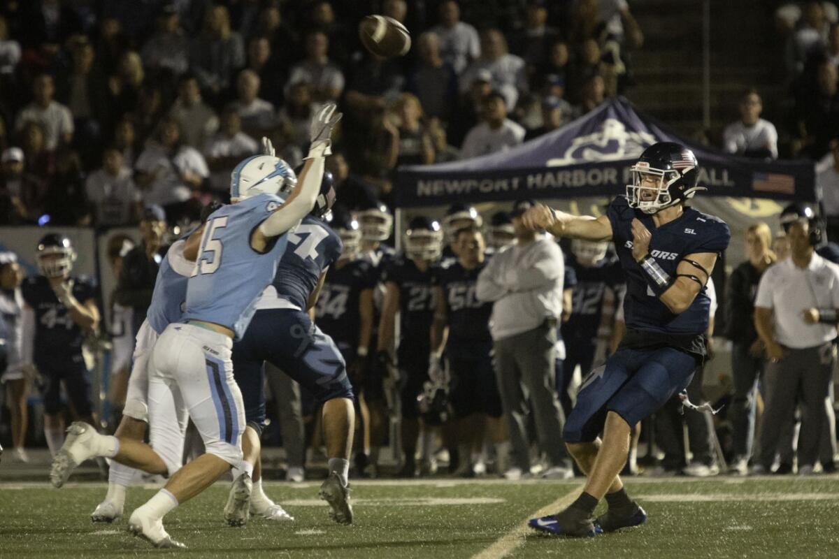 Newport Harbor's Colton Joseph throws a short pass for a first down against CdM in Friday night's game.