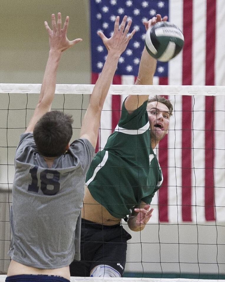 Edison HIgh's Garrett White hits past Newport Harbor's Ethan Talley during a Sunset League match at Edison on Tuesday.