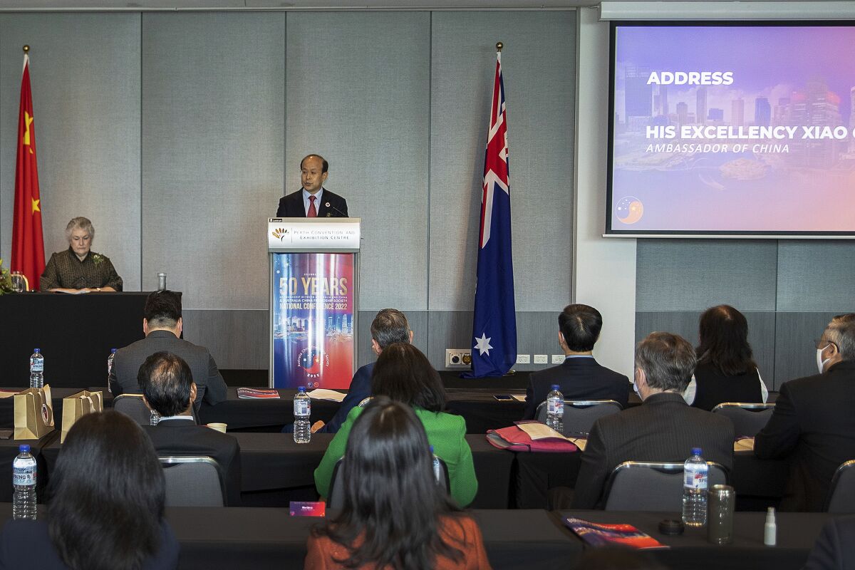 In this photo released by Xinhua News Agency, Chinese Ambassador to Australia Xiao Qian speaks as he attends a national conference of the Australia China Friendship Society (ACFS) in Perth, Australia, Saturday. June 11, 2022. Xiao says relations between the two countries are at a "new juncture" with the election of a new Australian government and the first minister-to-minister talks in more than two years. (Bai Xuefei/Xinhua via AP)