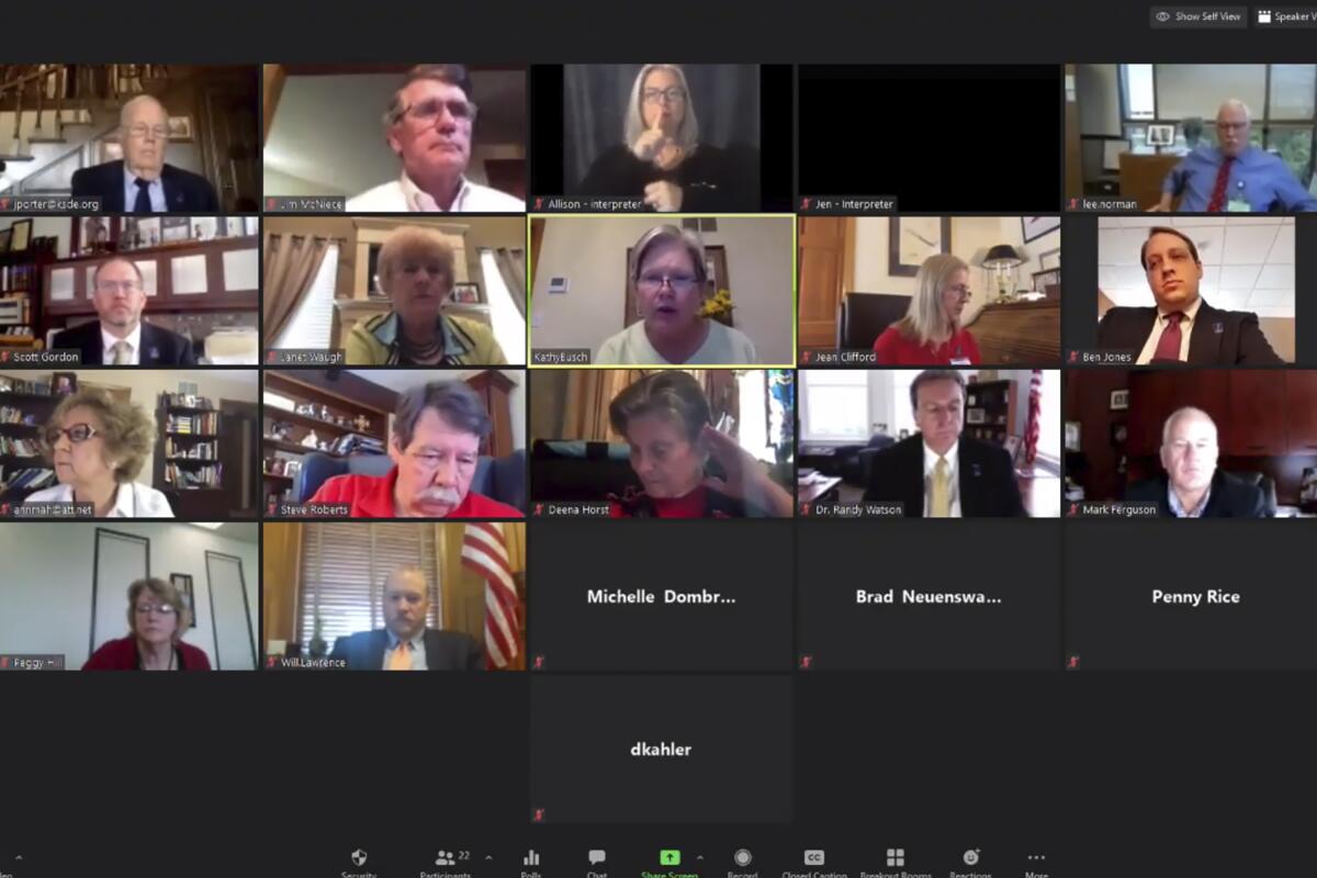 Members of the Kansas State Board of Education meet via Zoom with staffers and other officials in July. 