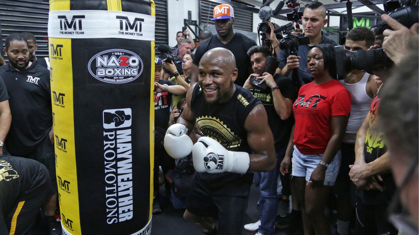 Floyd Mayweather Jr. shares some laughs while working out in front of the media at Mayweather Boxing Club in Las Vegas.