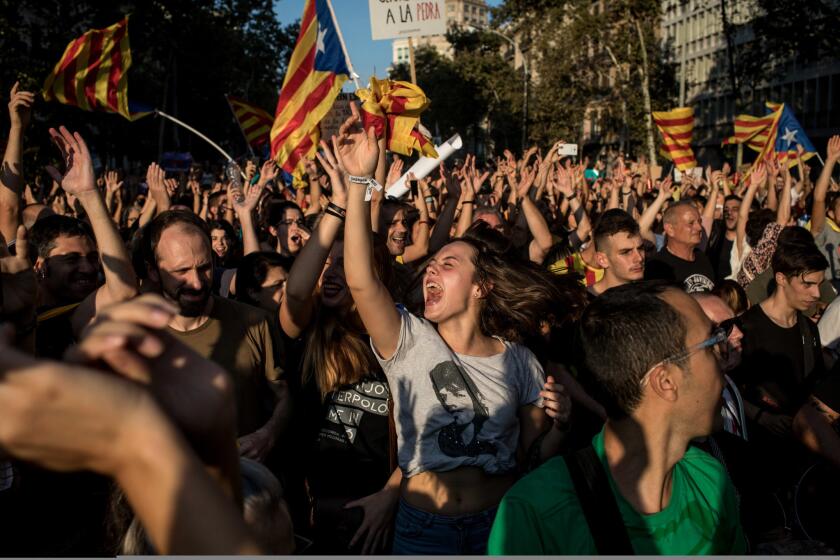 People dance and sing as thousands gather in the Plaza Universitat in Barcelona during a strike to protest the violence that marred Sunday's referendum vote. According to Catalonia's government, more than 2 million people voted in the Catalonia referendum, which the Spanish government has declared illegal and undemocratic.