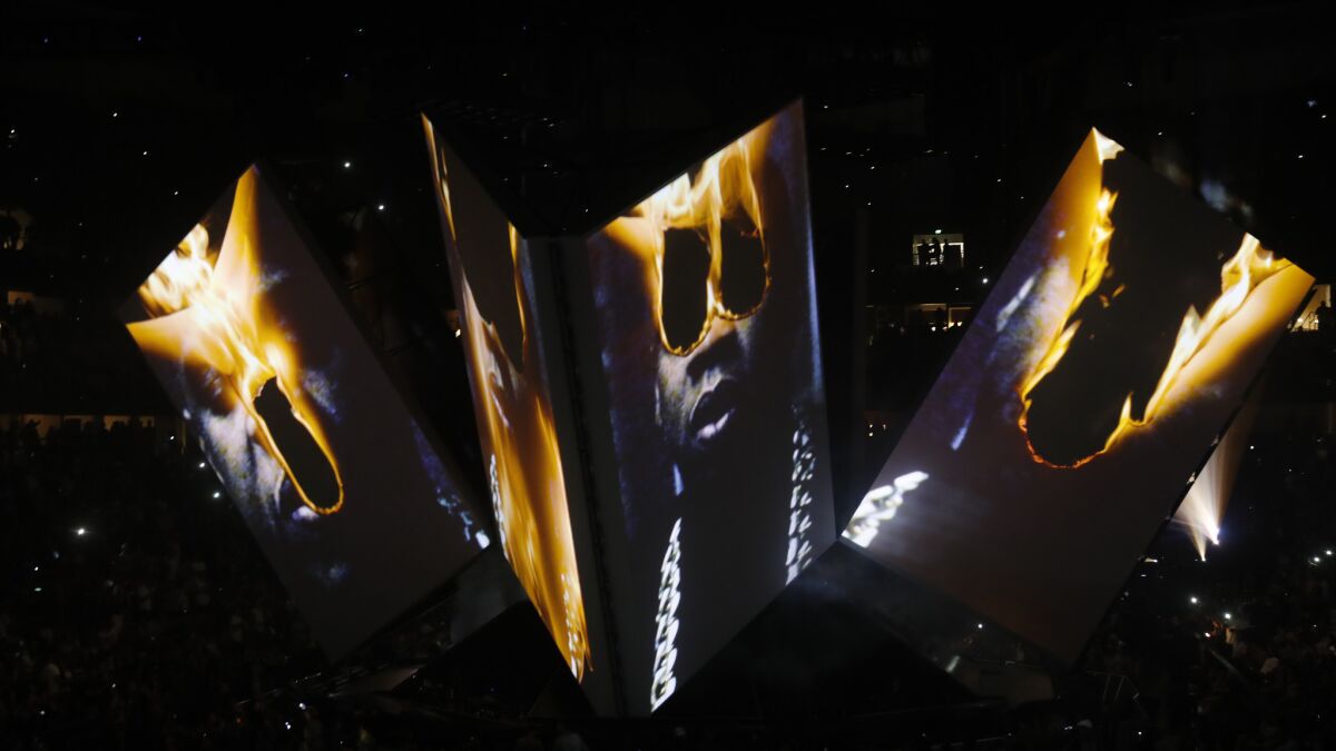 Screens showed images of flames burning Jay-Z's eyes.