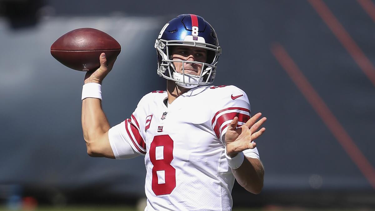 New York Giants quarterback Daniel Jones looks to pass.