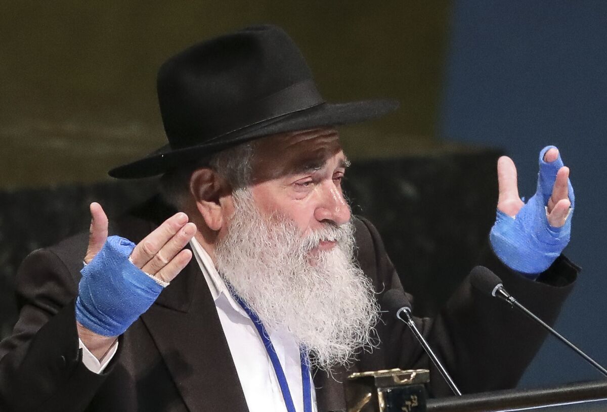 FILE - In this June 26, 2019, file photo, Rabbi Yisroel Goldstein, senior rabbi of the Chabad of Poway synagogue in San Diego, Calif., address the United Nations General Assembly at U.N. headquarters. Goldstein, who was badly wounded in a deadly antisemitic attack at the Chabad of Poway synagogue in Southern California, was sentenced Tuesday, Jan. 4, 2022, to 14 months in federal prison for running a multimillion-dollar donation fraud, authorities said. (AP Photo/Bebeto Matthews, File)