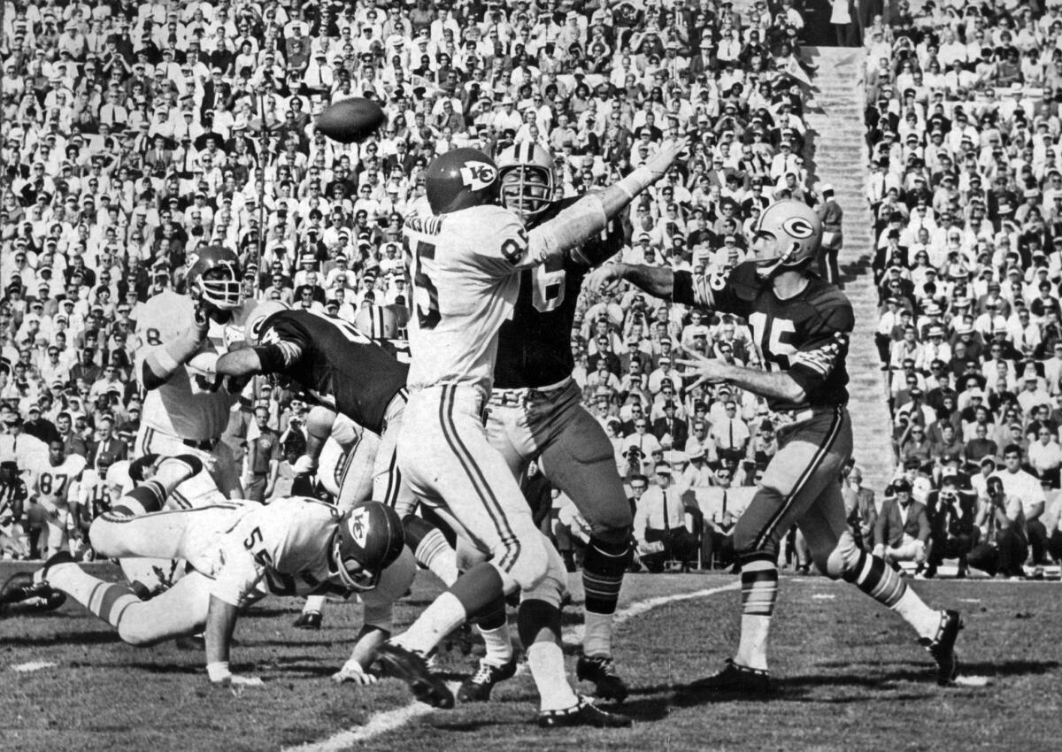 Jan. 15, 1967: Packers' Bart Starr throws a first quarter pass complete to Elijah Pitts during Super Bowl game against the Kansas City Chiefs.