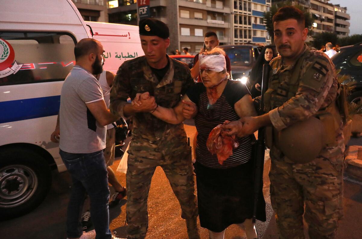 Wounded woman receives help after Beirut explosion