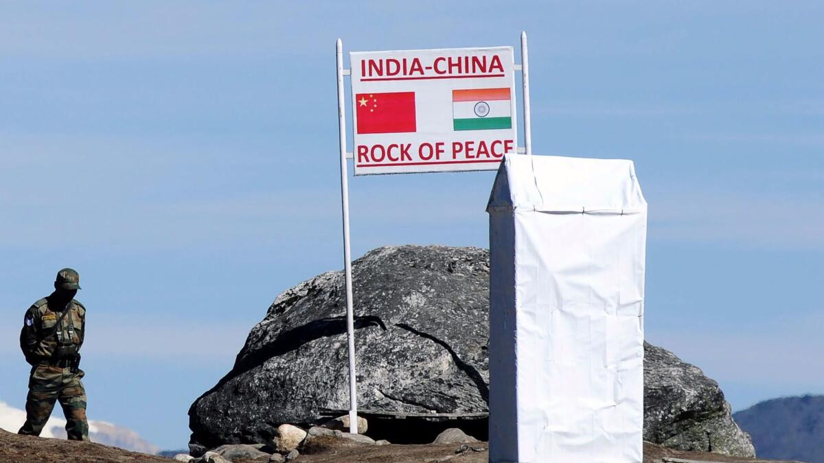 An Indian soldier keeps watch at Bumla Pass on the India-China border in Arunachal Pradesh on Oct. 21, 2012.