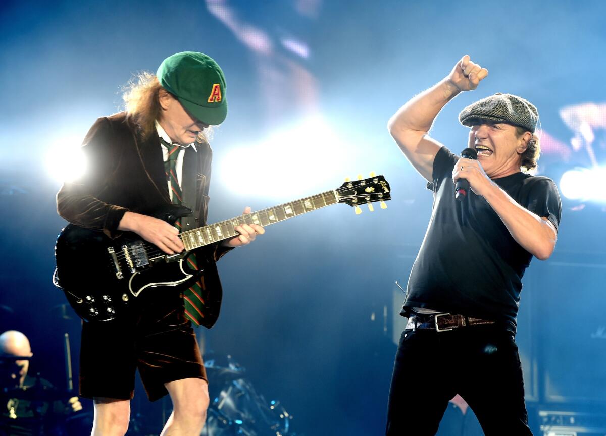 Angus Young, left, and Brian Johnson of AC/DC at Monday's Dodger Stadium concert in Los Angeles.