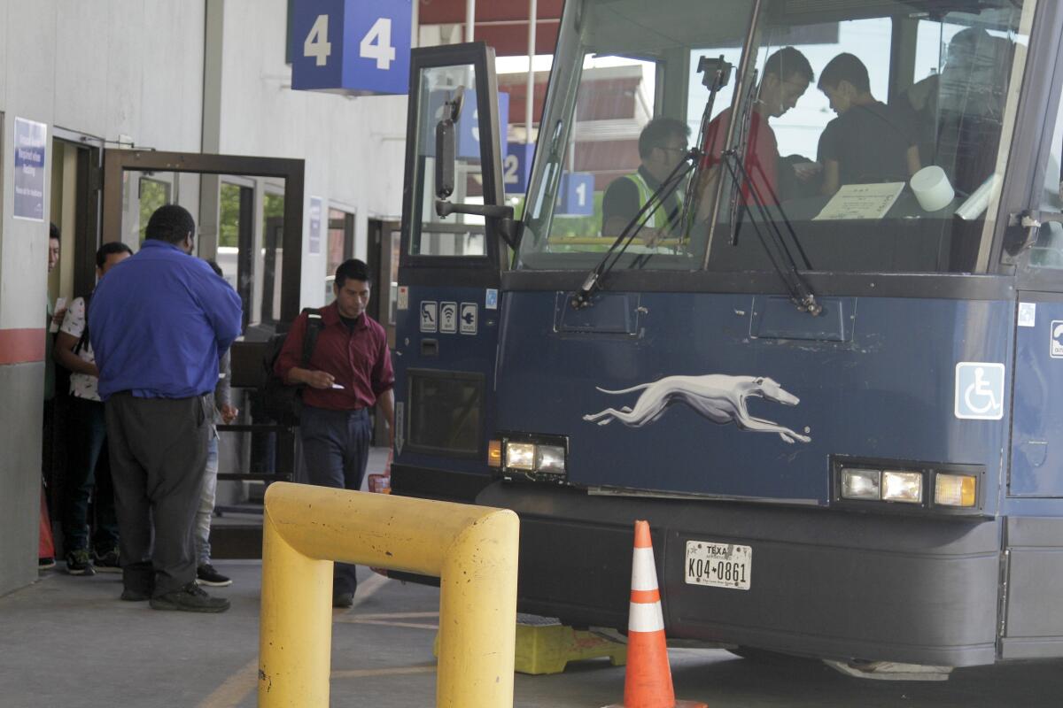 Passengers board a Greyhound bus in El Paso in 2019.